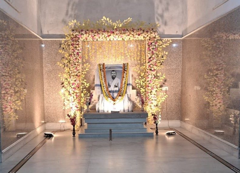 The inner shrine hall of the ashram, decorated with flowers